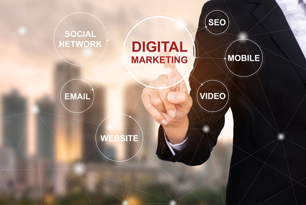 Business professional pointing to digital marketing diagram with icons for SEO, email, and social network
